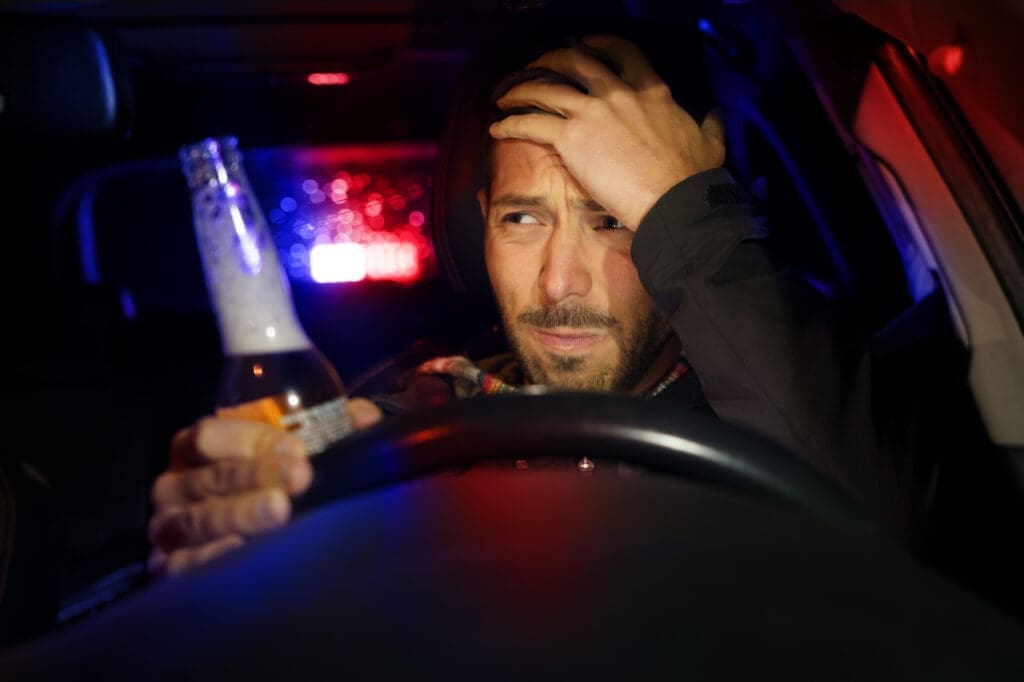 Drunk man driving car. Police stopped driver under alcohol influence dwi dui driving while intoxicated driving under the influence